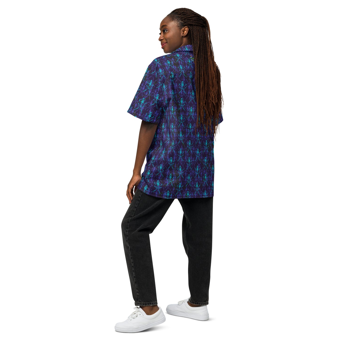 Model wearing the Anura button down shirt with purple black and turquoise frog bones from the back.