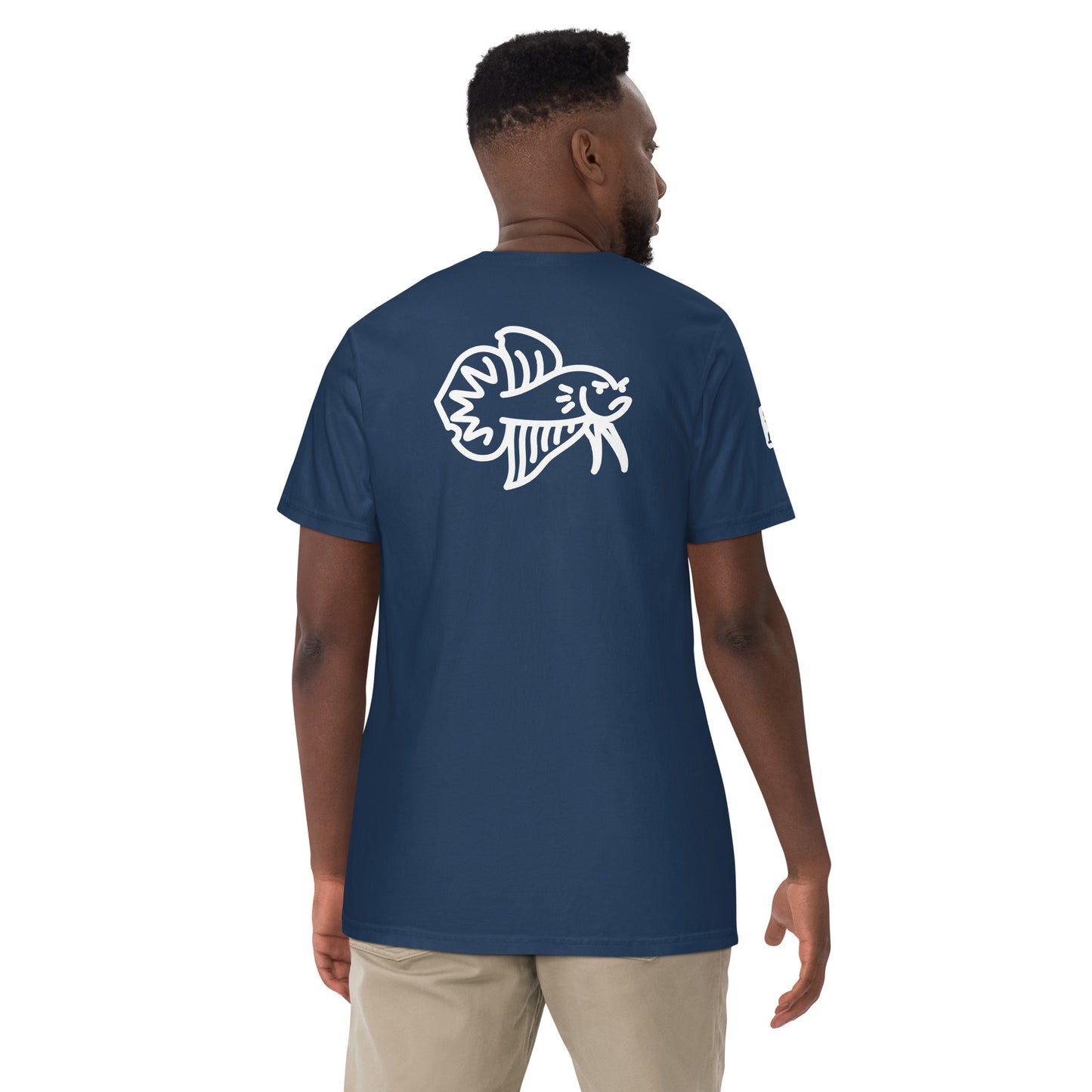 Male Model wearing the true navy blue Betta Si fighting fish T-Shirt from the back showing the bad betta character illustration.