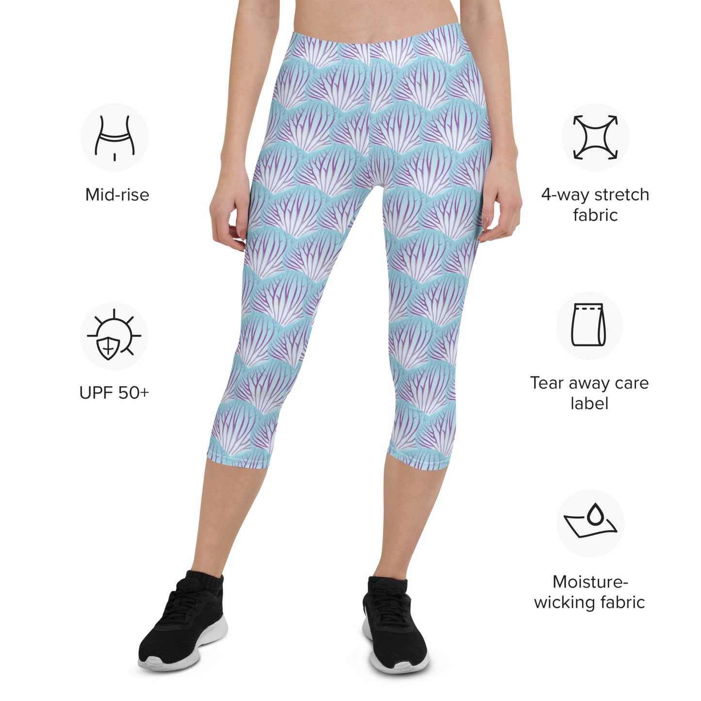 Woman modeling the Orchid Petal printed apri leggings from the front with feature descriptions.