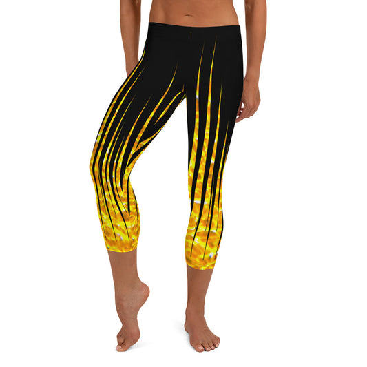 Woman modeling the Black and Fire printed Fired Up Capri leggings from the front.