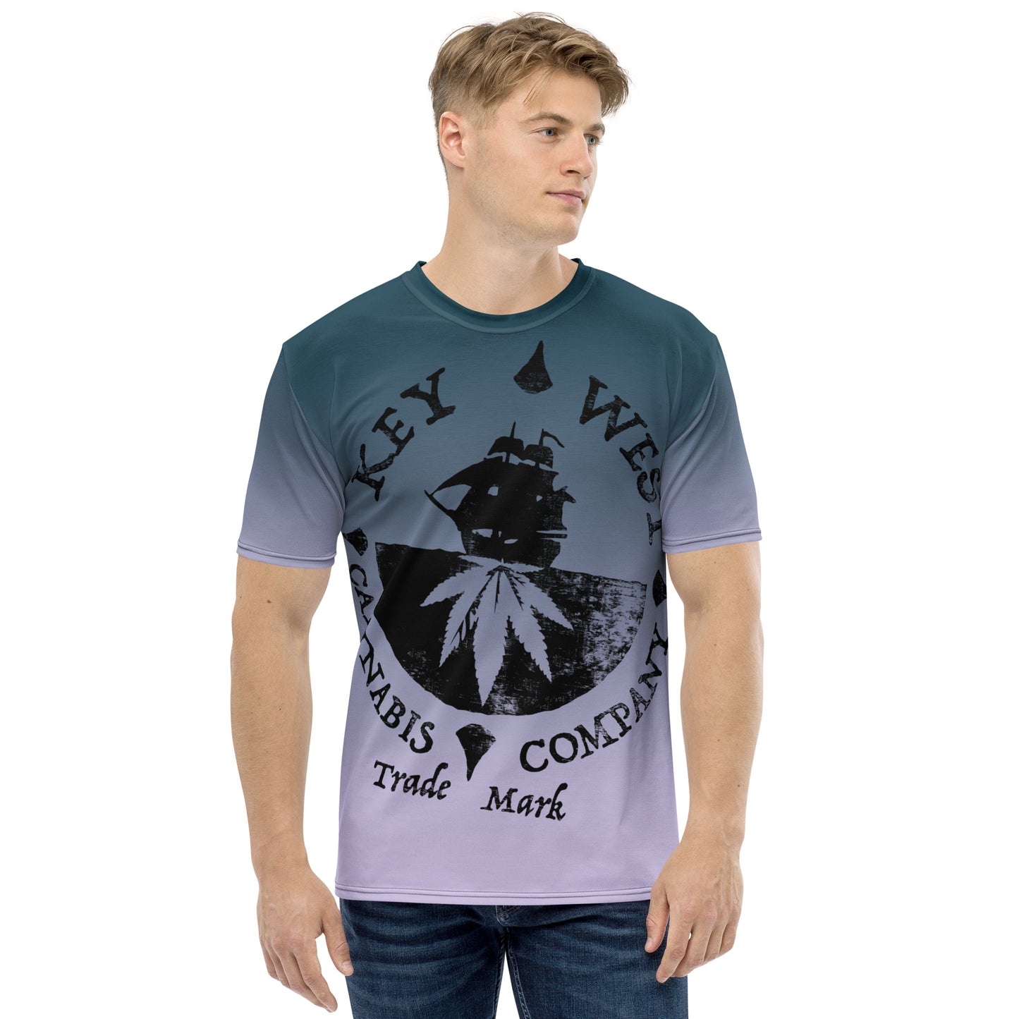 Man modeling the Key West Cannabis Company Brand T-shirt with oversize print on a gradient background from the front.