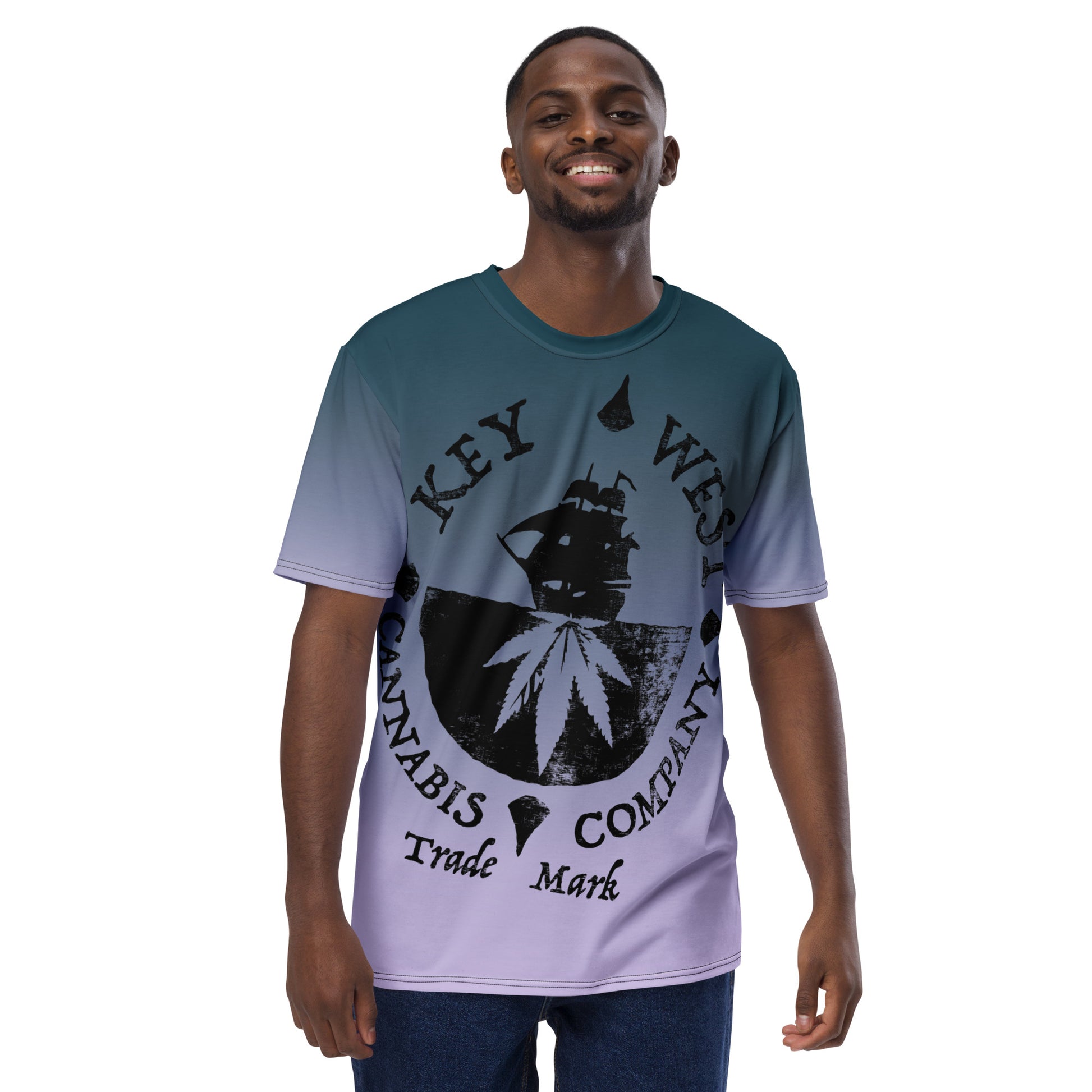 Man modeling the Key West Cannabis Company Brand T-shirt with oversize print on a gradient background from the front.