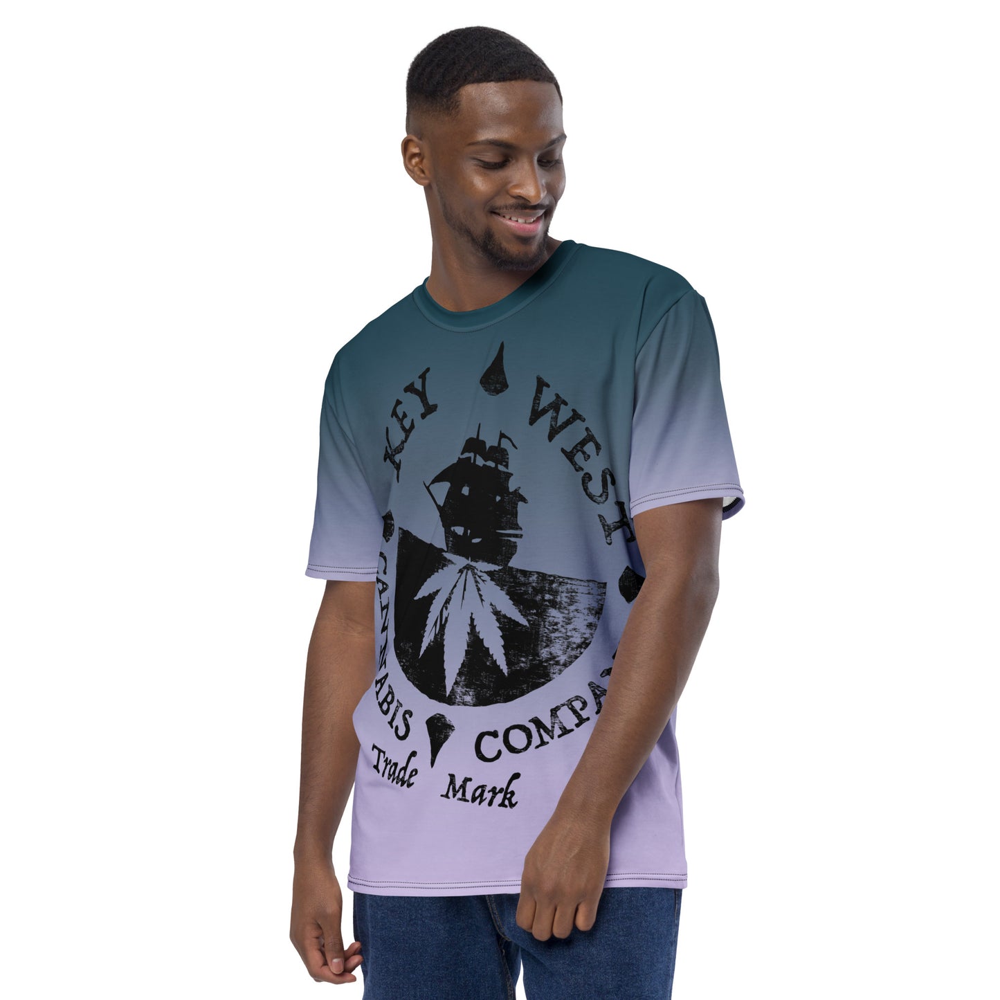 Man modeling the Key West Cannabis Company Brand T-shirt with oversize print on a gradient background from the front.