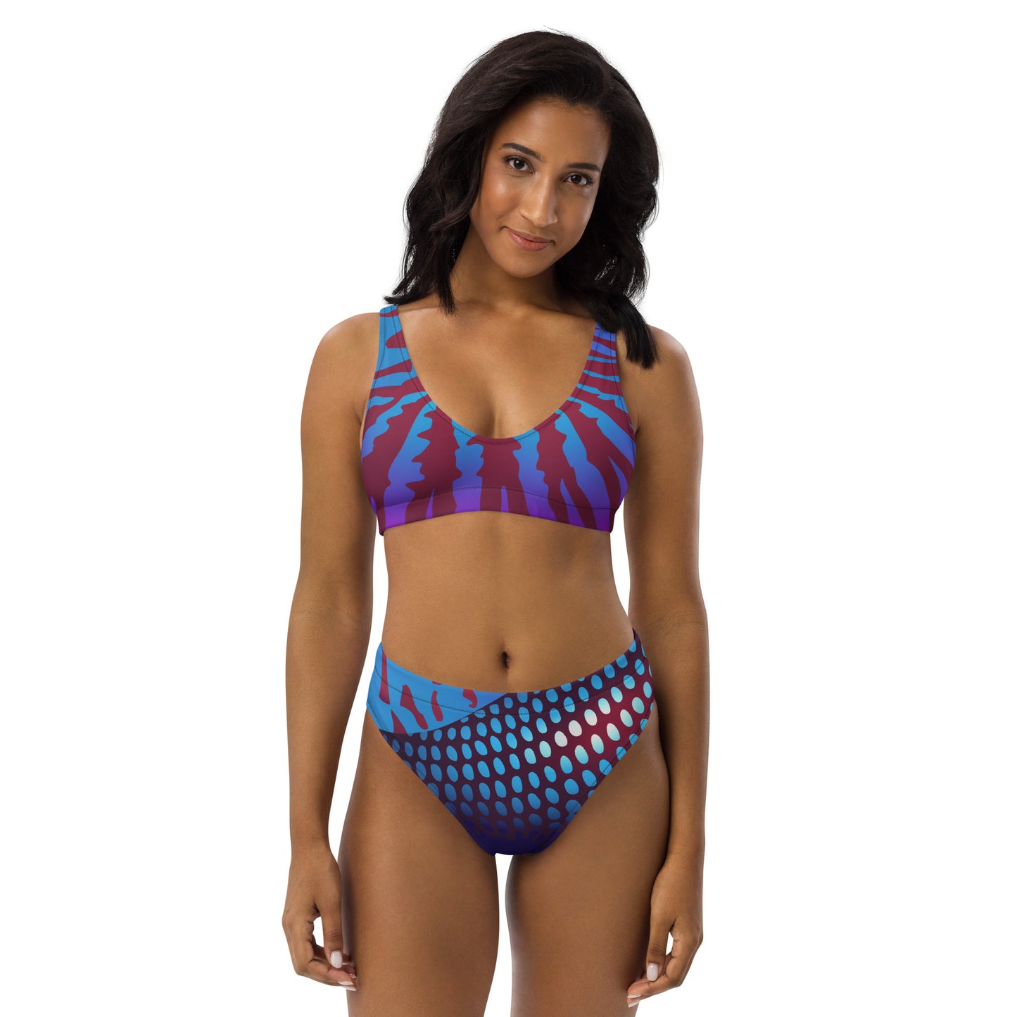Woman modeling the Betta Ruk Bakini Swimsuit in purples, reds, and blue patterns from the front.