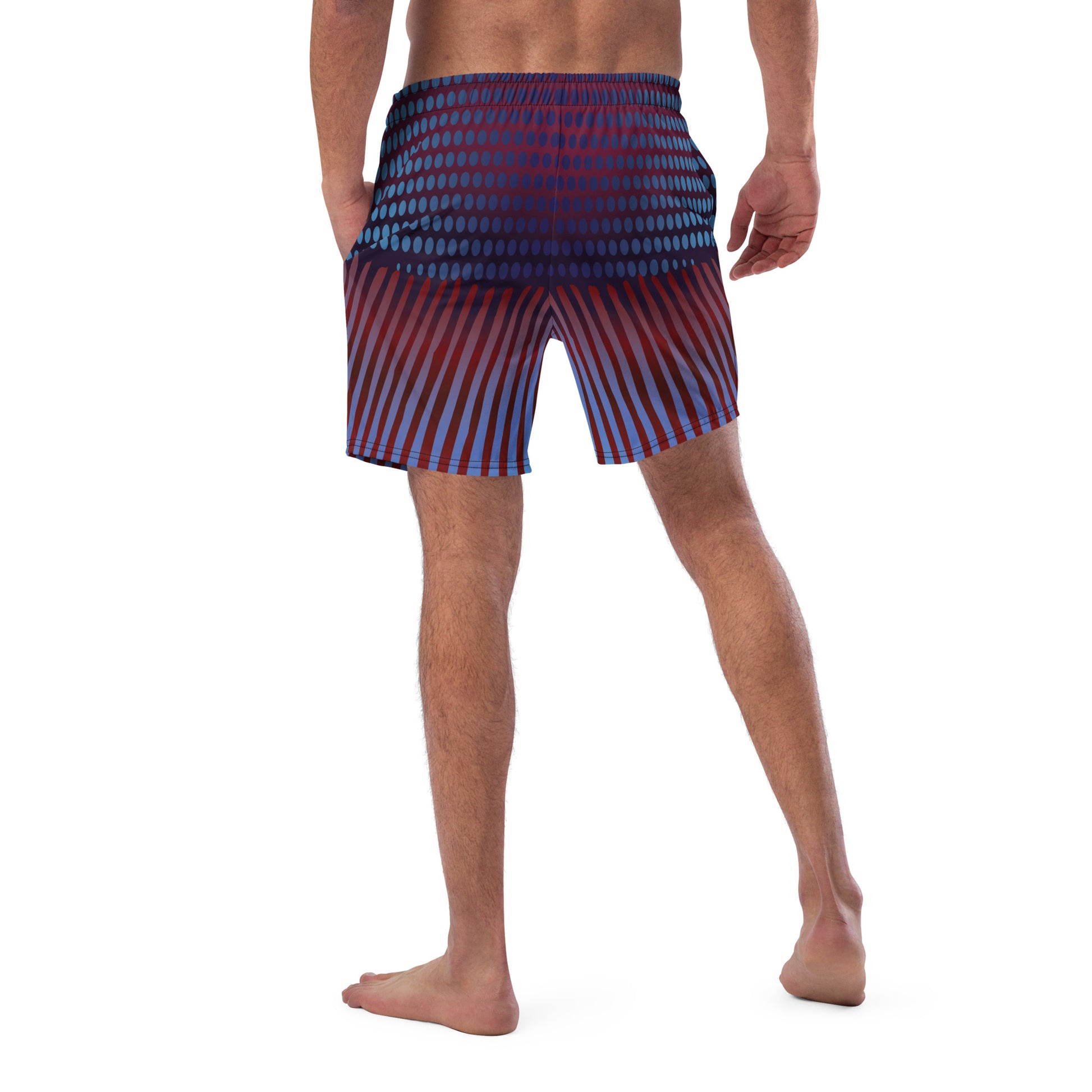 Man modeling the Betta Kang Swim trunks from the back in Blues, Purples, and Deep Reds.