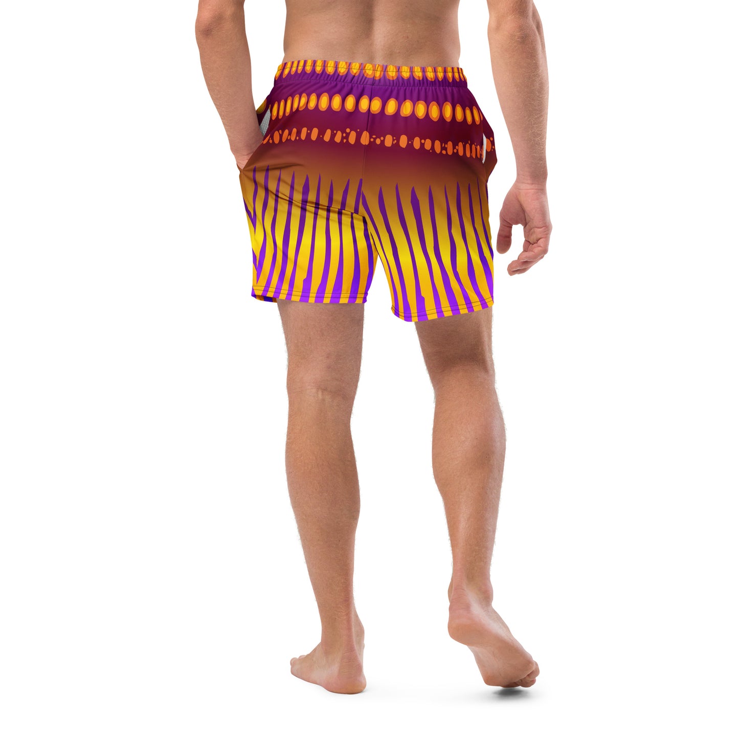 Man modeling the Betta Jet Swim trunks from the back in purples oranges yellows and maroon.