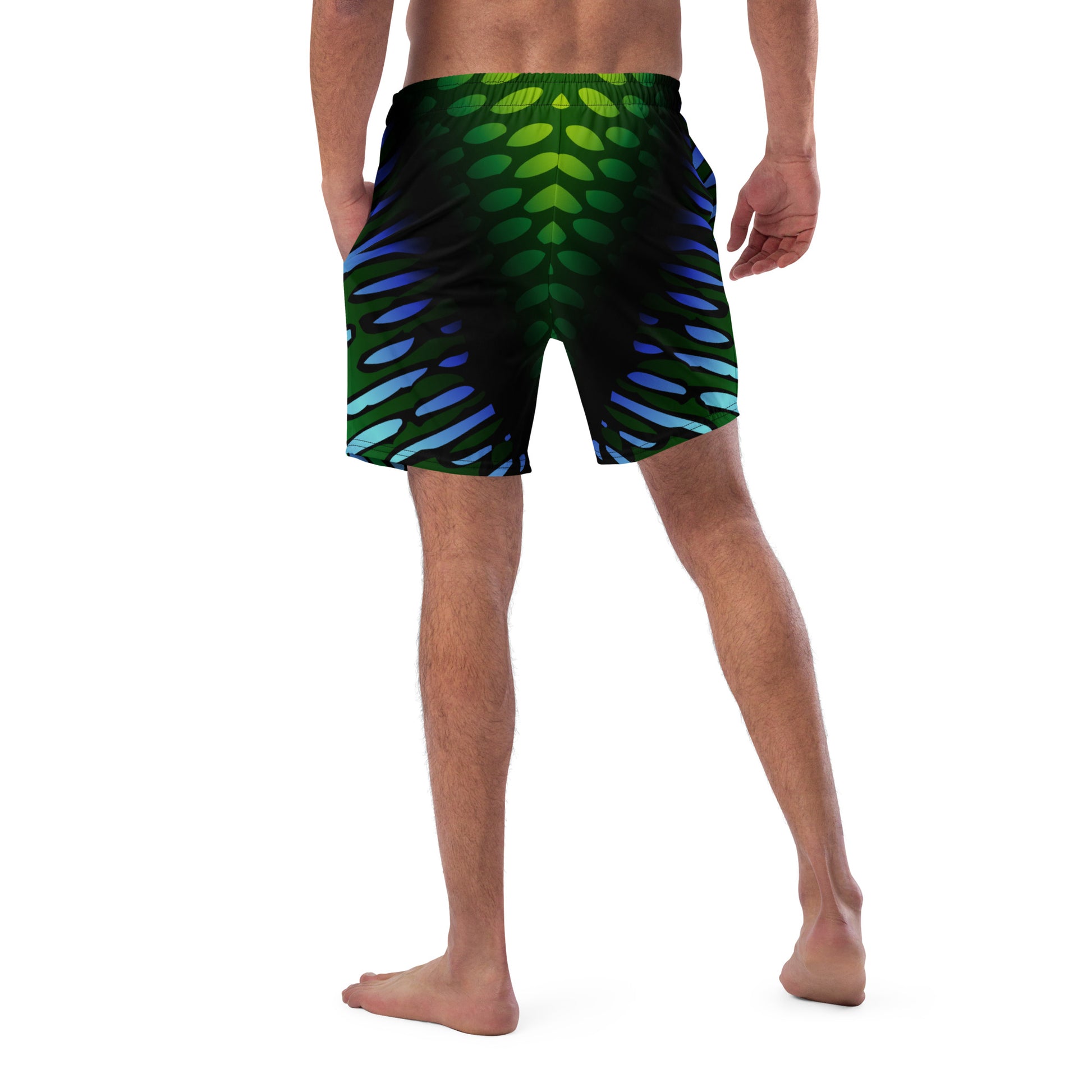 Male model wearing the Betta Yak Mens swim trunks in blue and green from the rear.