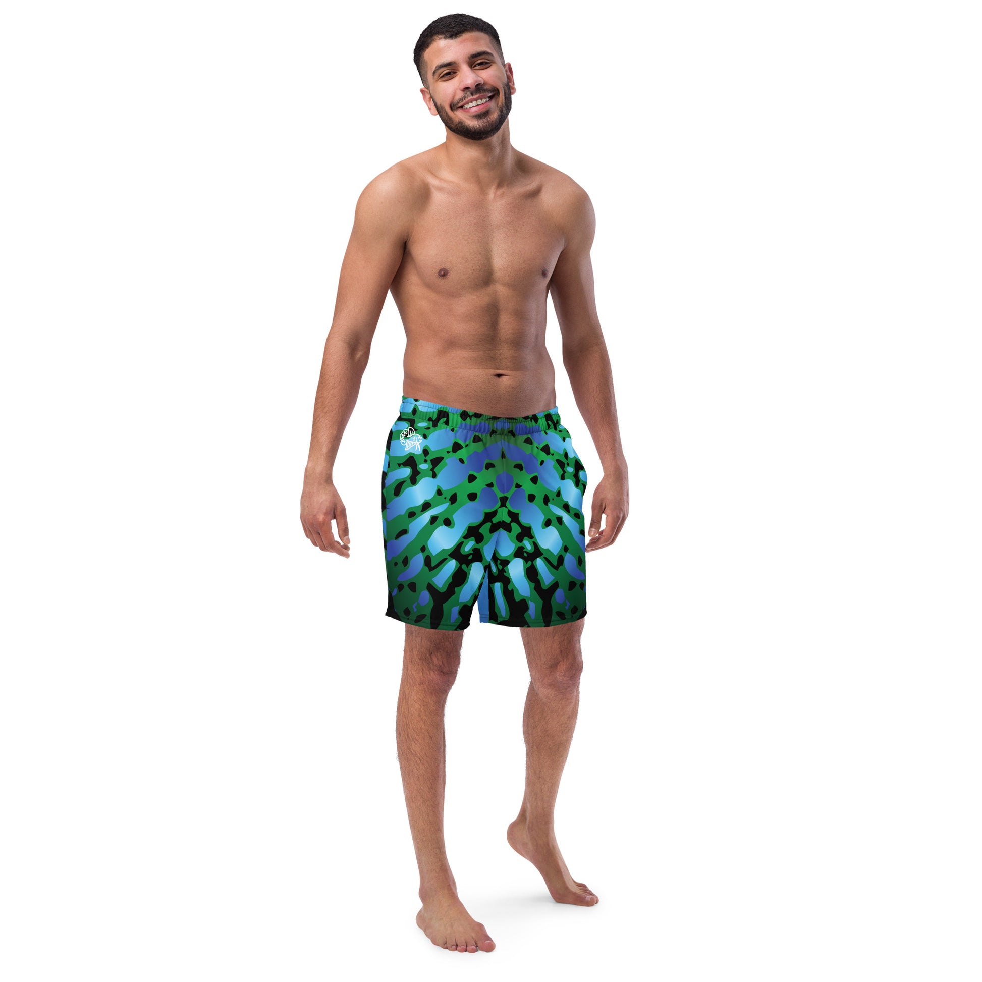Man modeling the Betta Muay Swim trunks from the front in Blues, Greens, and Black.