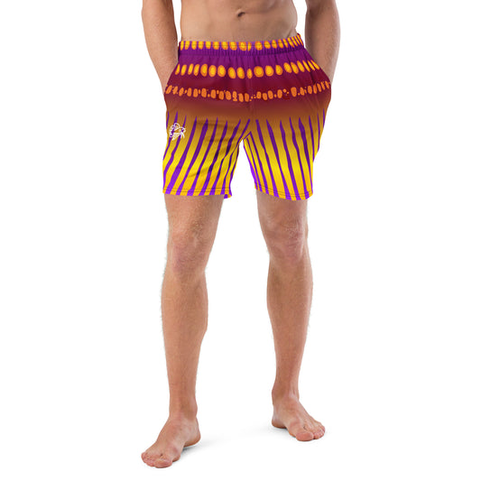 Man modeling the Betta Jet Swim trunks from the front in purples, oranges, yellows, and maroon.
