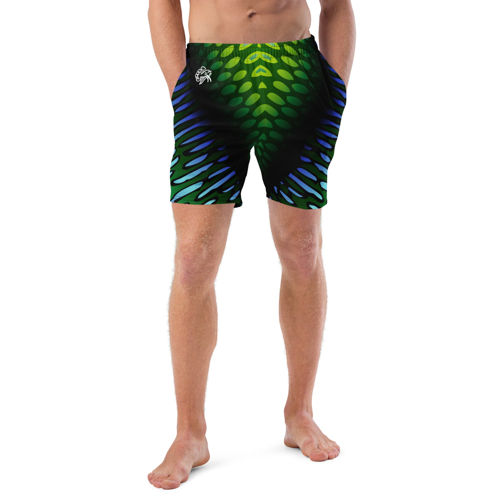 Male model wearing the Betta Yak Mens swim trunks in blue and green from the front.