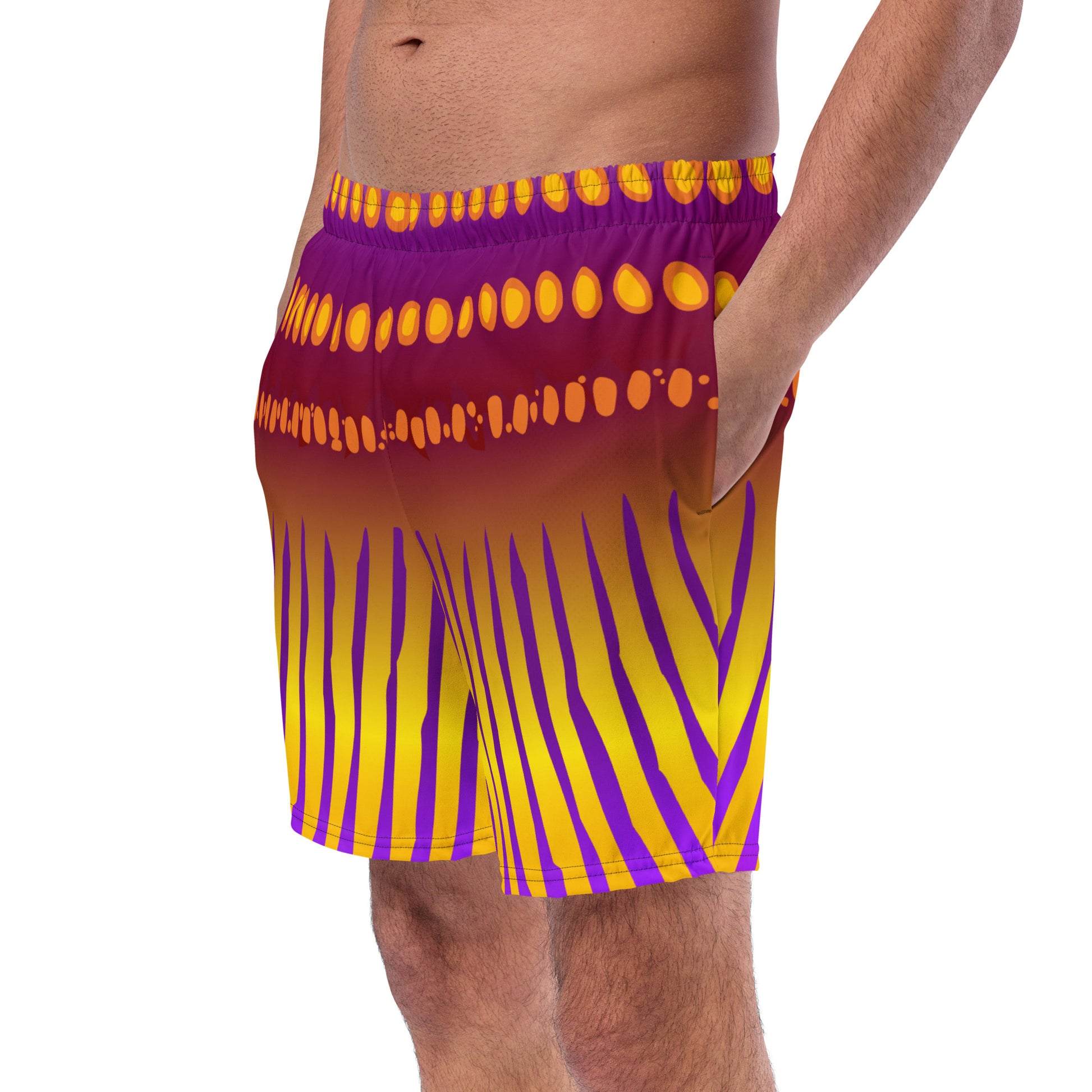 Close up of man modeling the Betta Jet Swim trunks from the front-side in purples, oranges, yellows, and maroon.