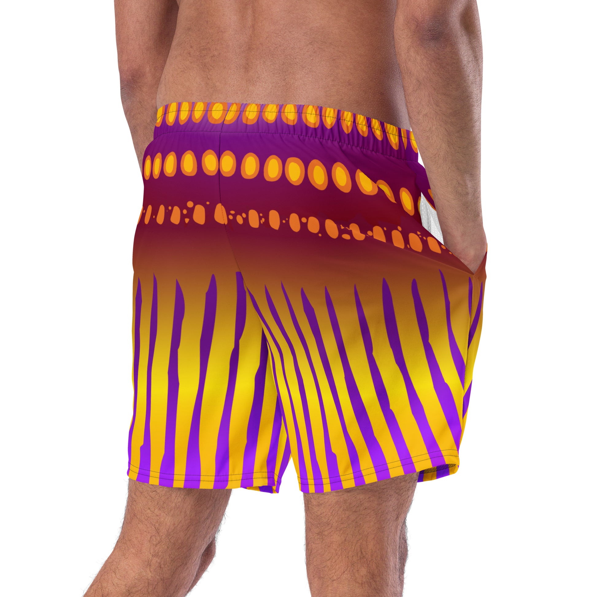Close Up of Man modeling the Betta Jet Swim trunks from the back in purples oranges yellows and maroon.