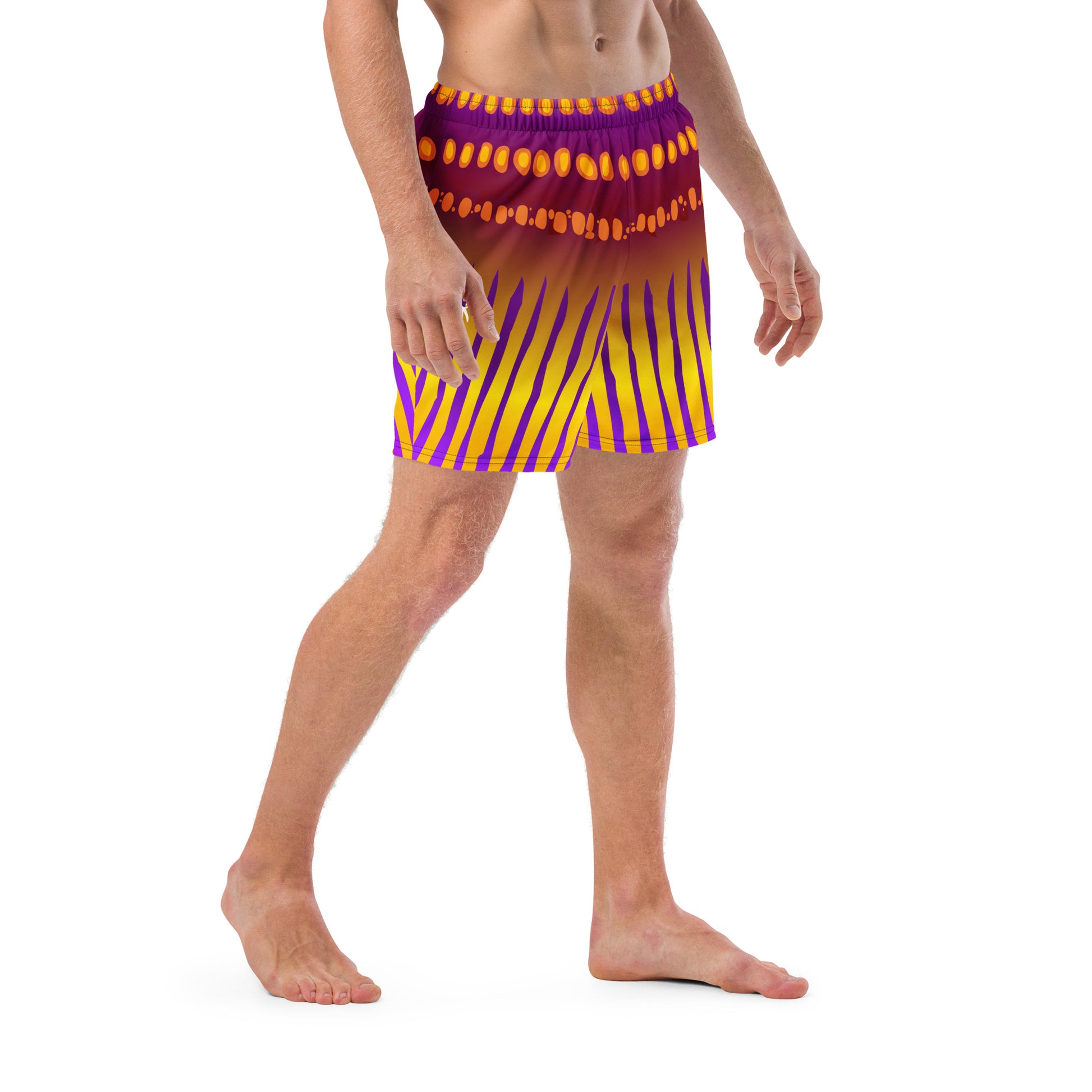 Man modeling the Betta Jet Swim trunks from the side in purples oranges yellows and maroon.