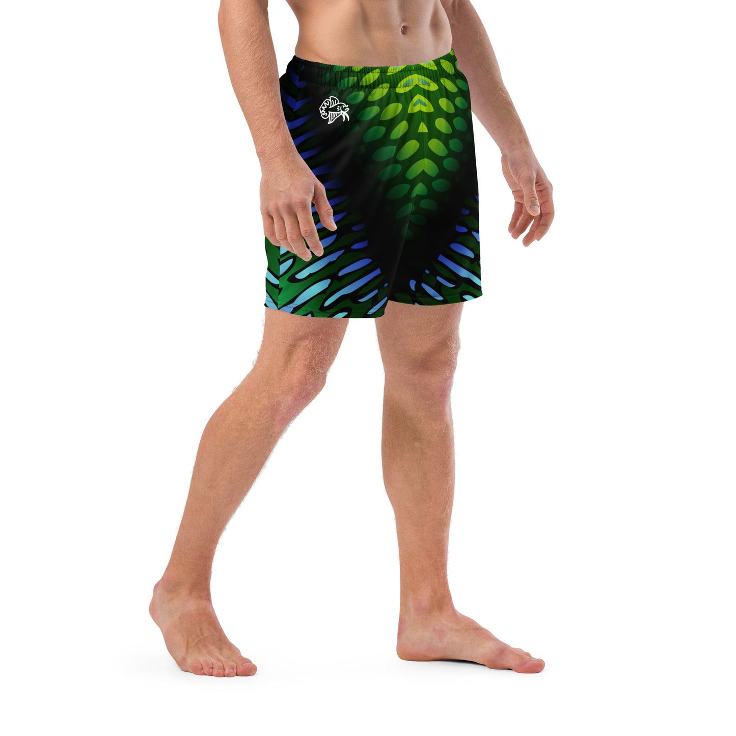 Male model wearing the Betta Yak Mens swim trunks in blue and green from the right side.