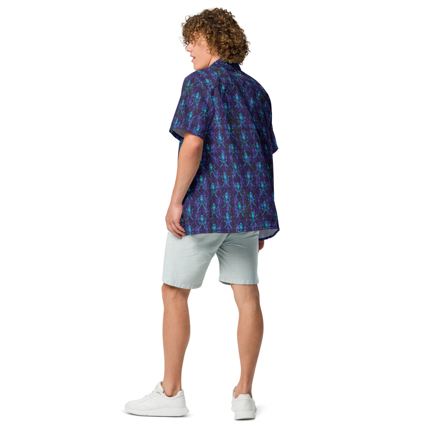 Male model wearing the Anura Zeta Button down shirt with purple black and turquoise frog bones from the back quarter.