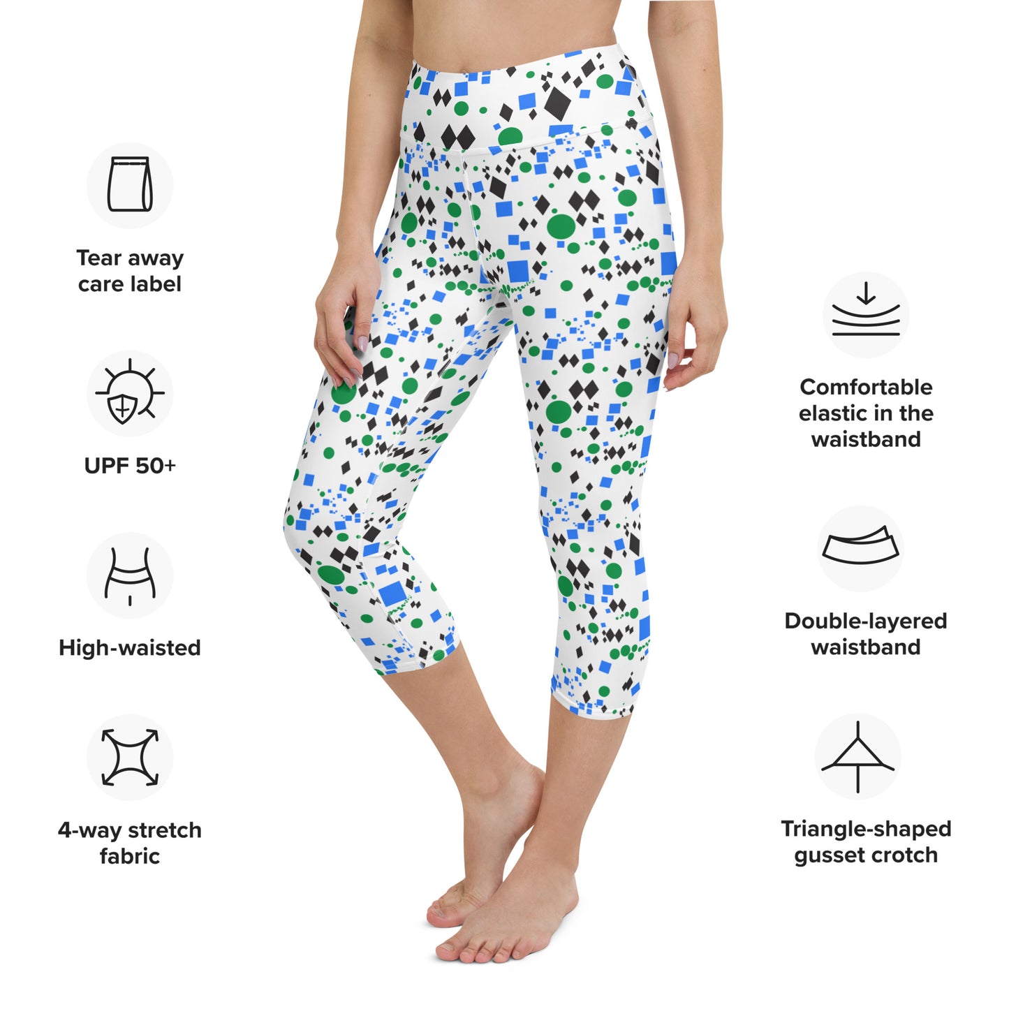 Woman modeling the Trail Marker capri leggings from the front with product feature details.