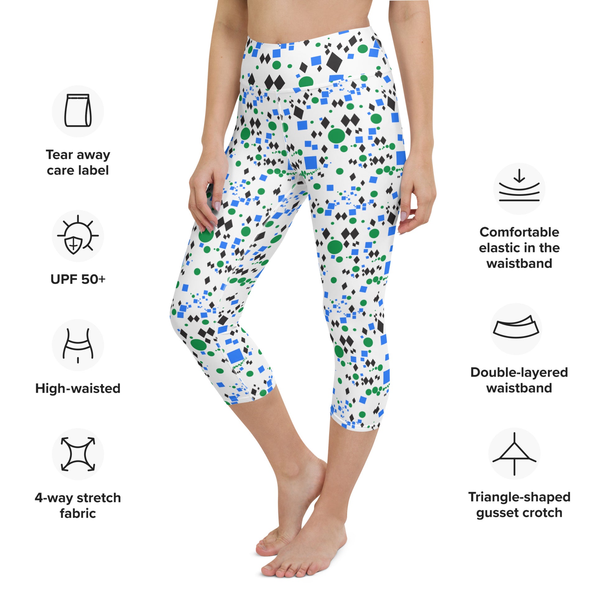 Woman modeling the Trail Marker capri leggings from the front with product feature details.