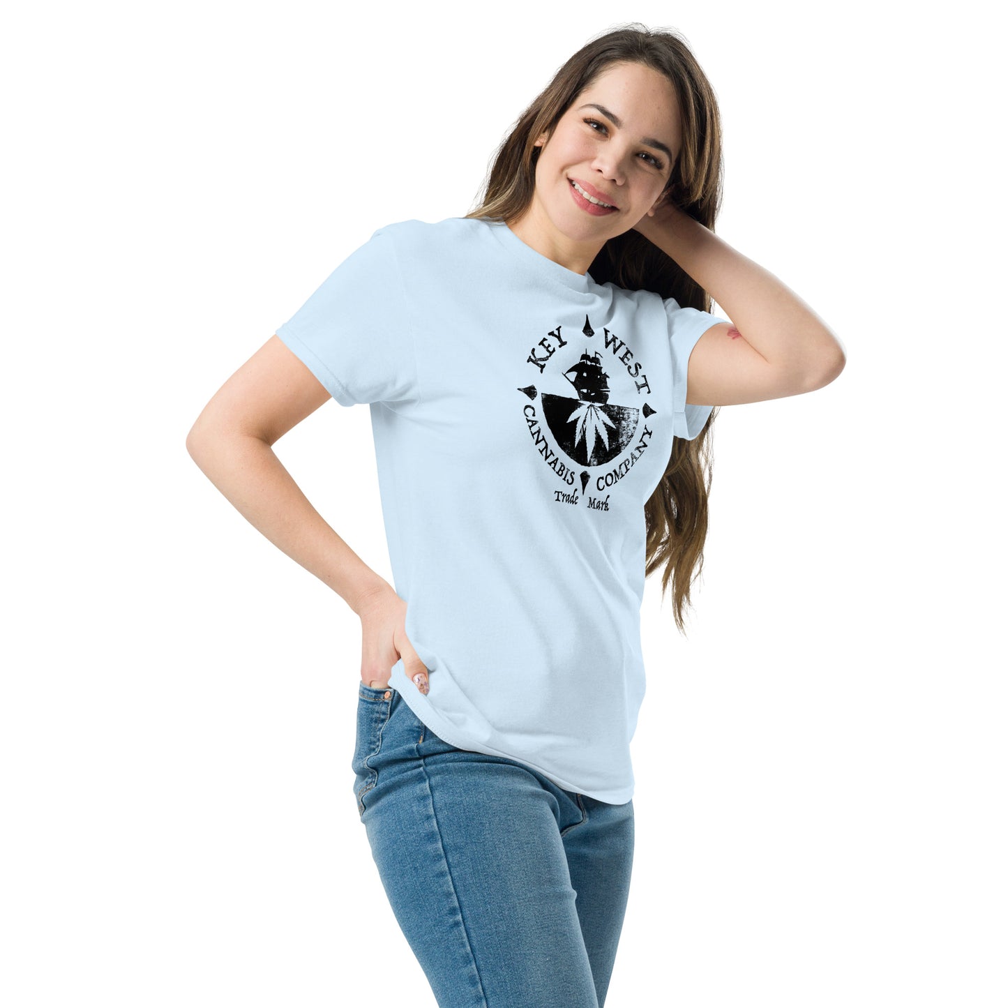 Woman modeling the Key West Cannabis Company Brand graphic in black on a light blue T-shirt from the right front.