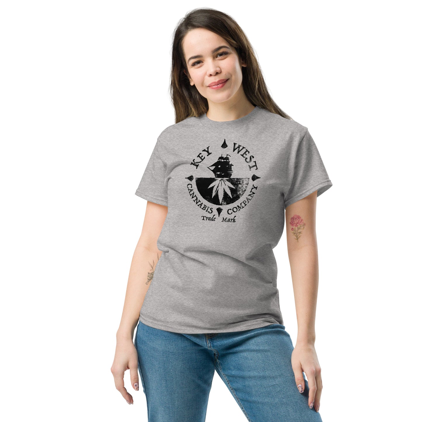 Woman modeling the Key West Cannabis Company Brand graphic in black on a Sport Grey Color T-shirt from the front.