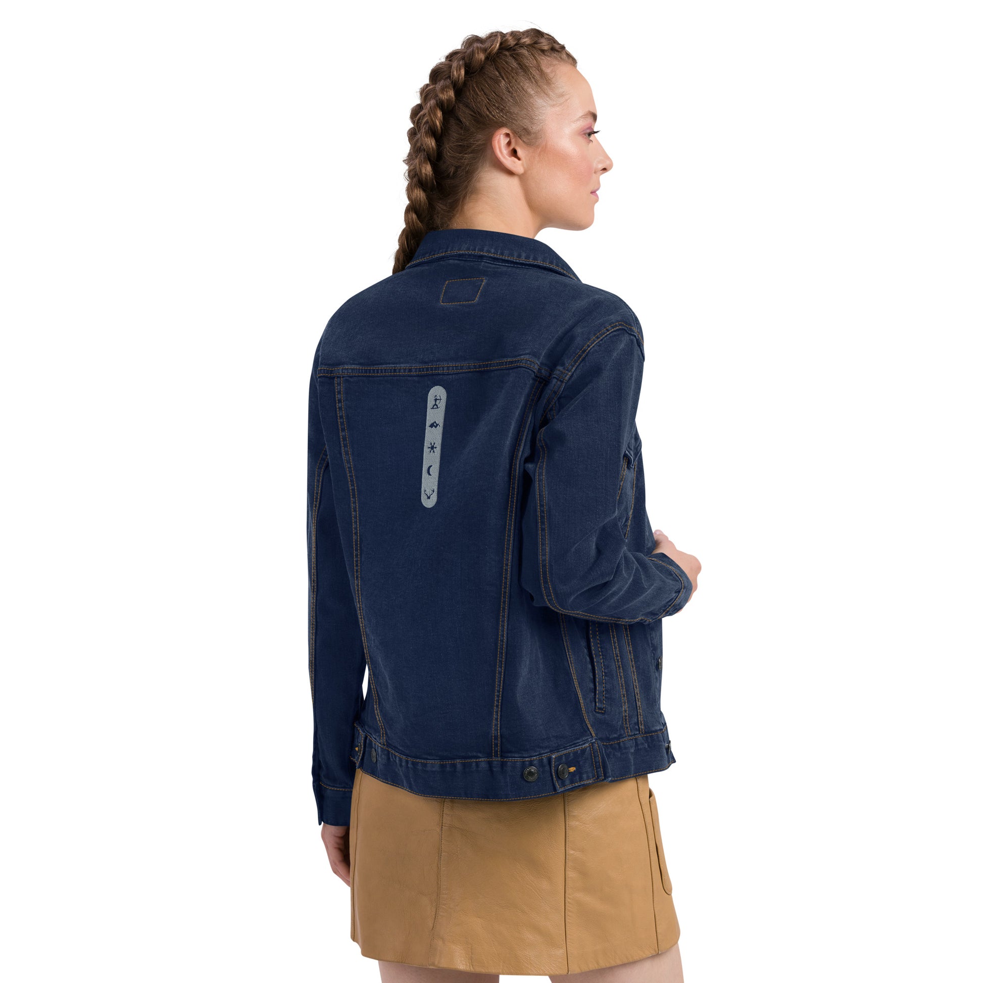 Female Model wearing House Ullr Unisex Denim Jacket from the back right side in blue Denim.
