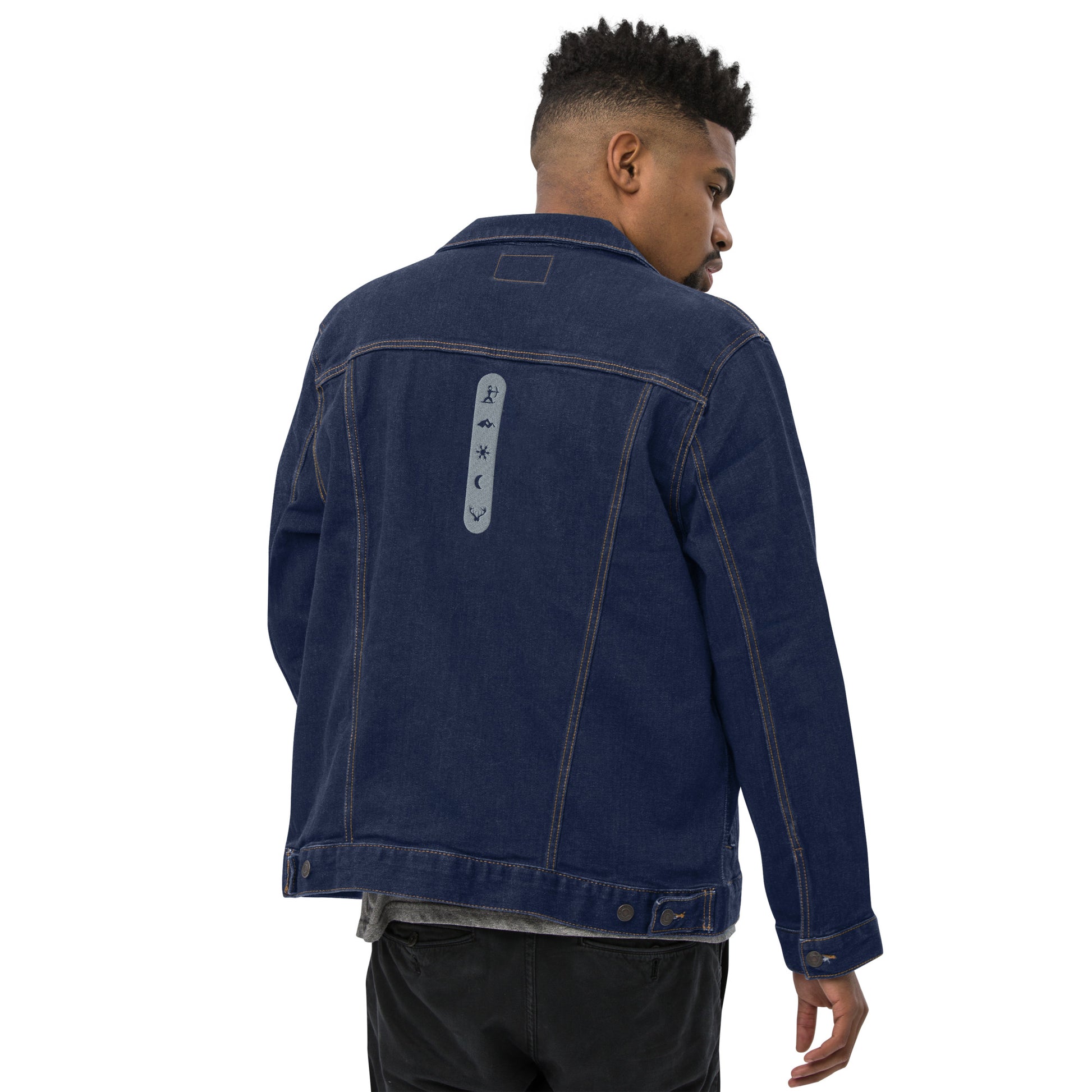 Male model wearing House Ullr Unisex Denim Jacket from the back in Blue Denim showing House Story embroidery.