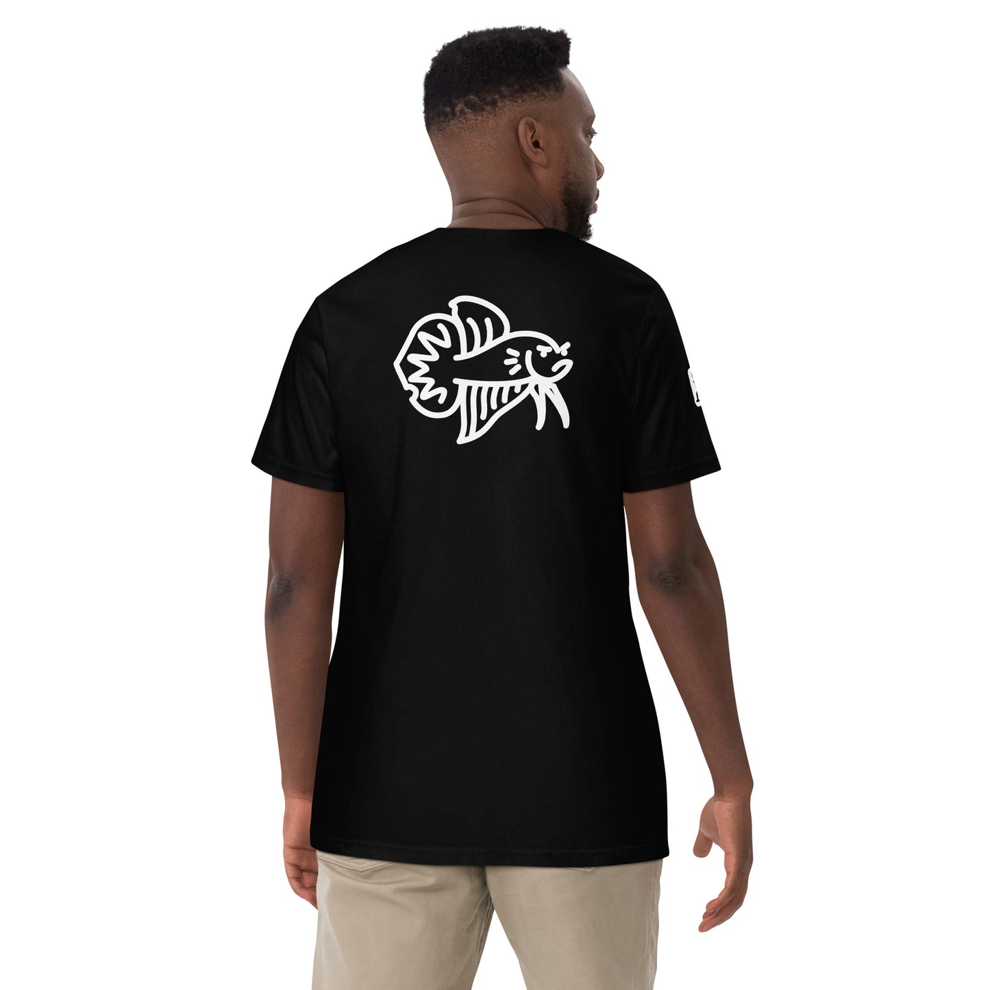 Male Model wearing the black Betta Si fighting fish T-Shirt from the back showing the bad betta character illustration.