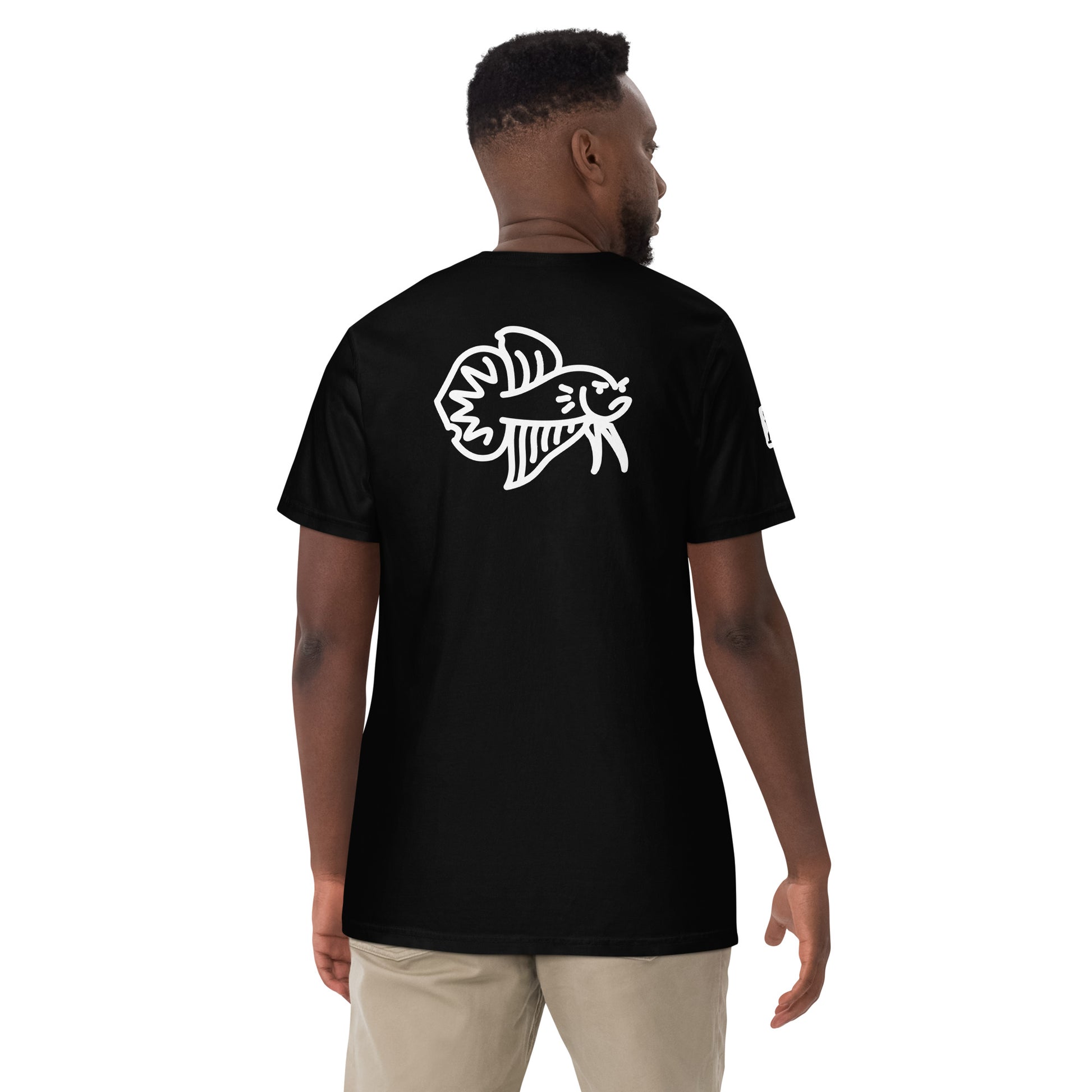 Male Model wearing the black Betta Si fighting fish T-Shirt from the back showing the bad betta character illustration.