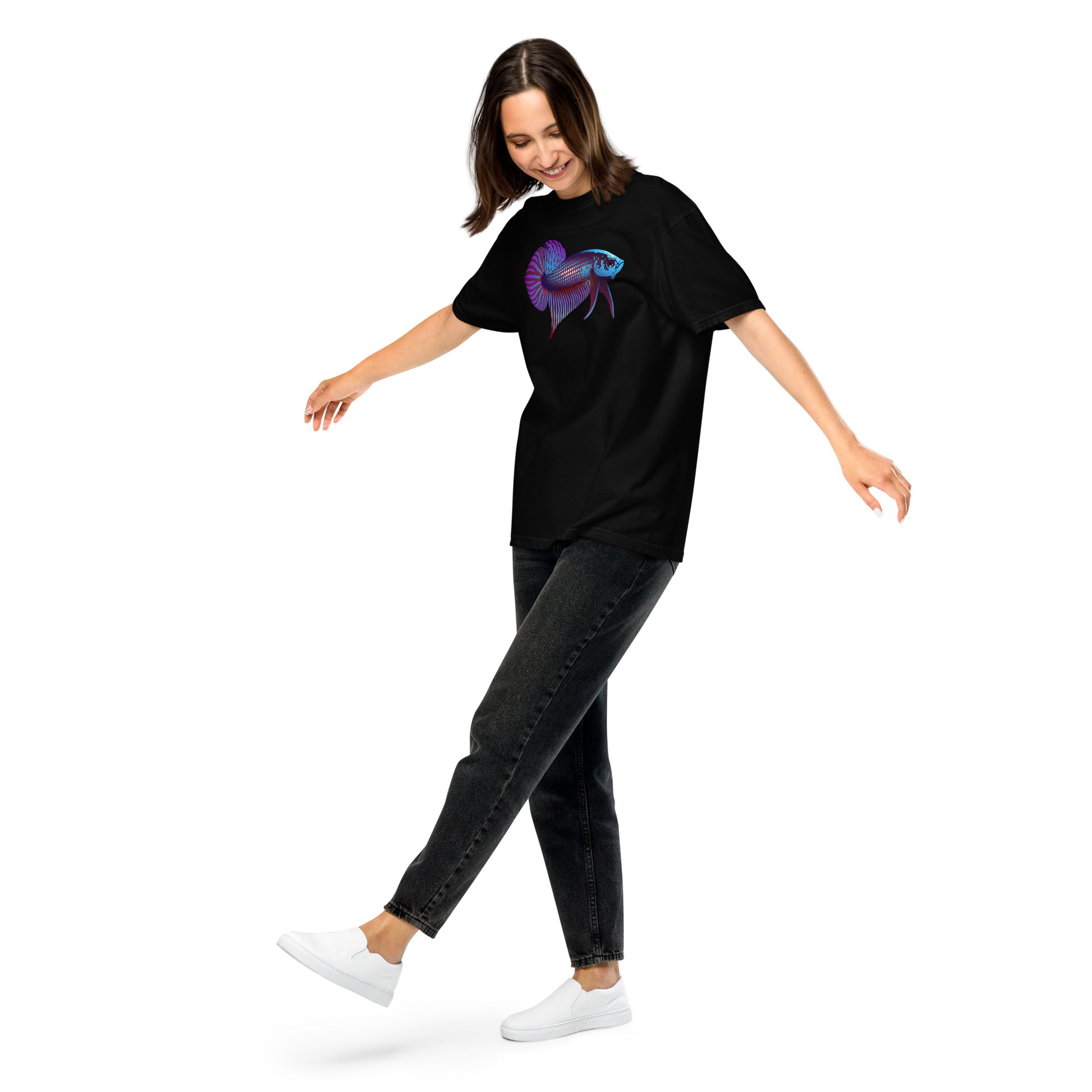 Female Model wearing the Betta Si fighting fish T-Shirt in Blues, reds, and purples from the left front, kicking her foot up.