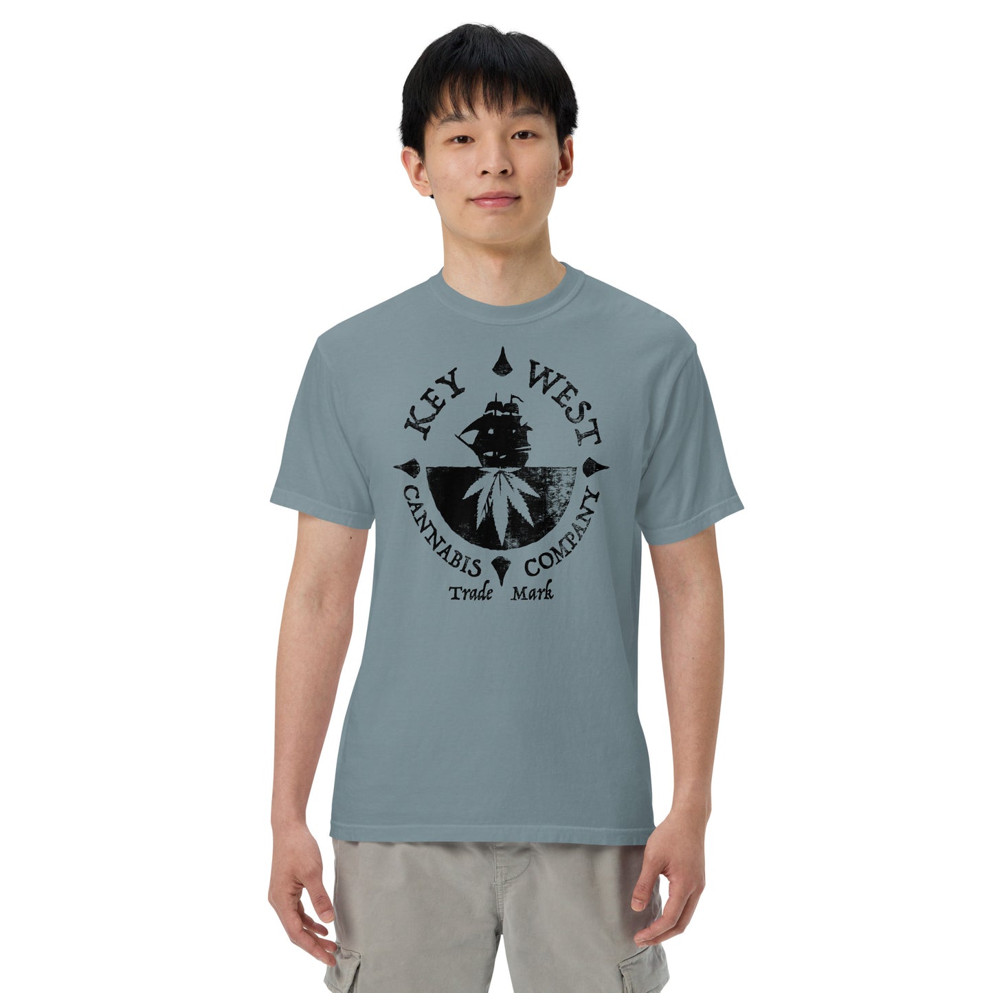 Man modeling the Key West Cannabis Company Brand T-shirt in Ice Blue from the front.
