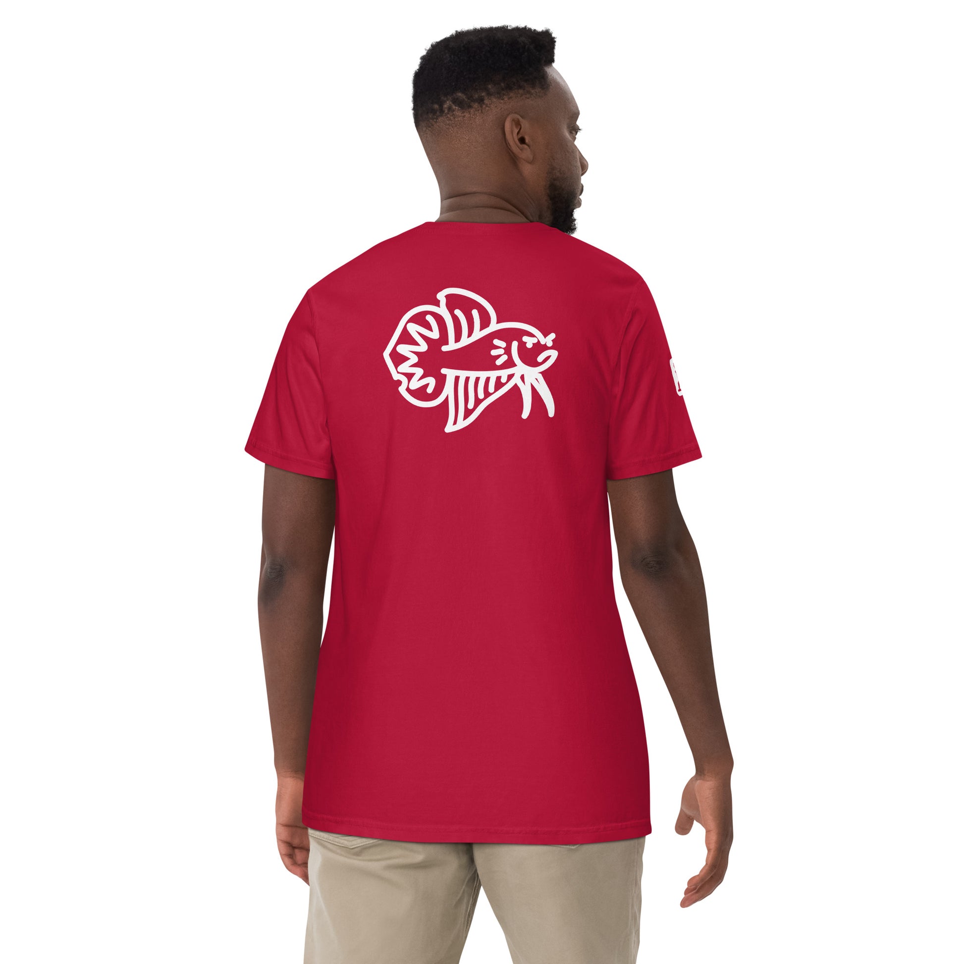 Male Model wearing the red Betta Si fighting fish T-Shirt from the back showing the bad betta character illustration.