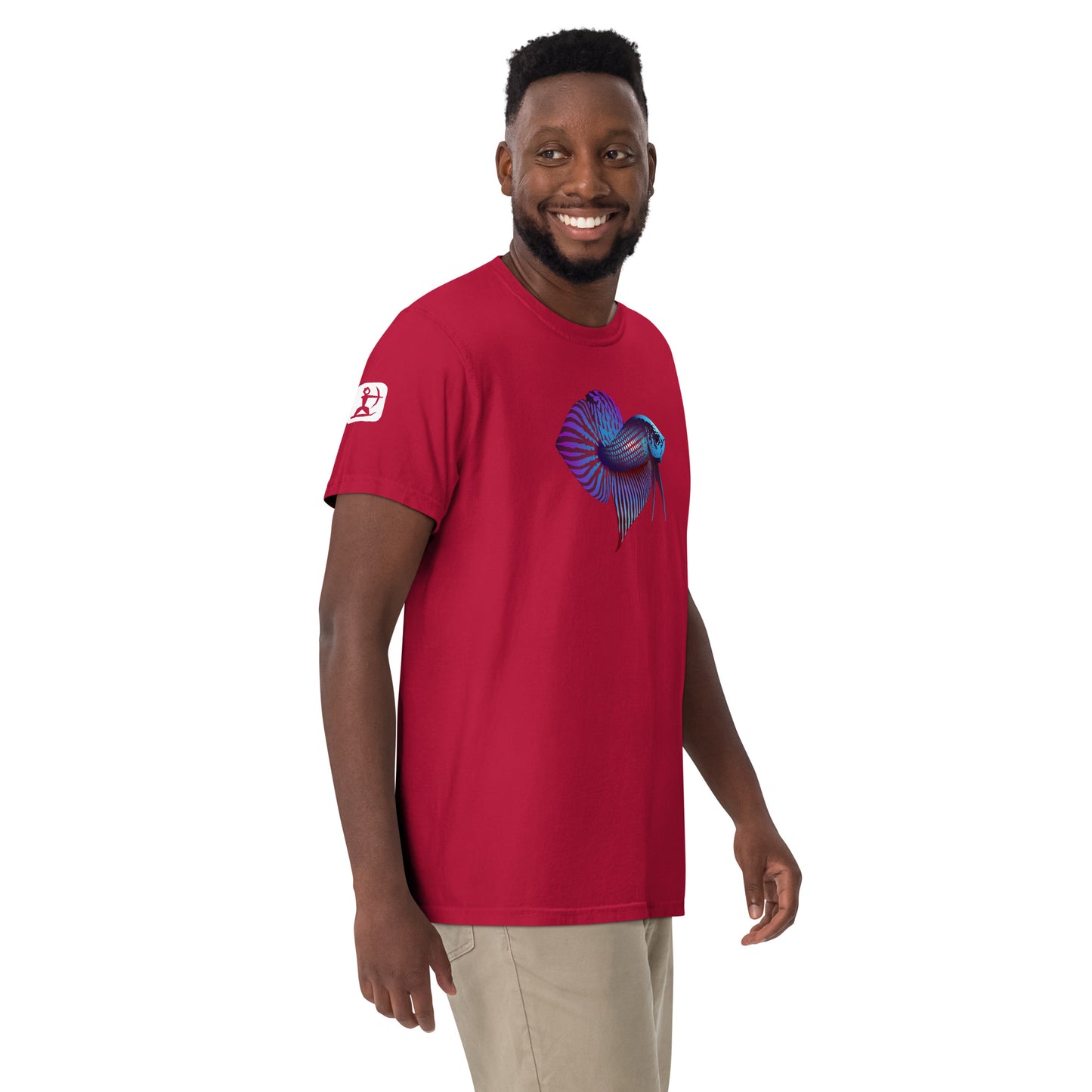 Male Model wearing the red Betta Si fighting fish T-Shirt from the front right side showing the Houes Ullr Icon.